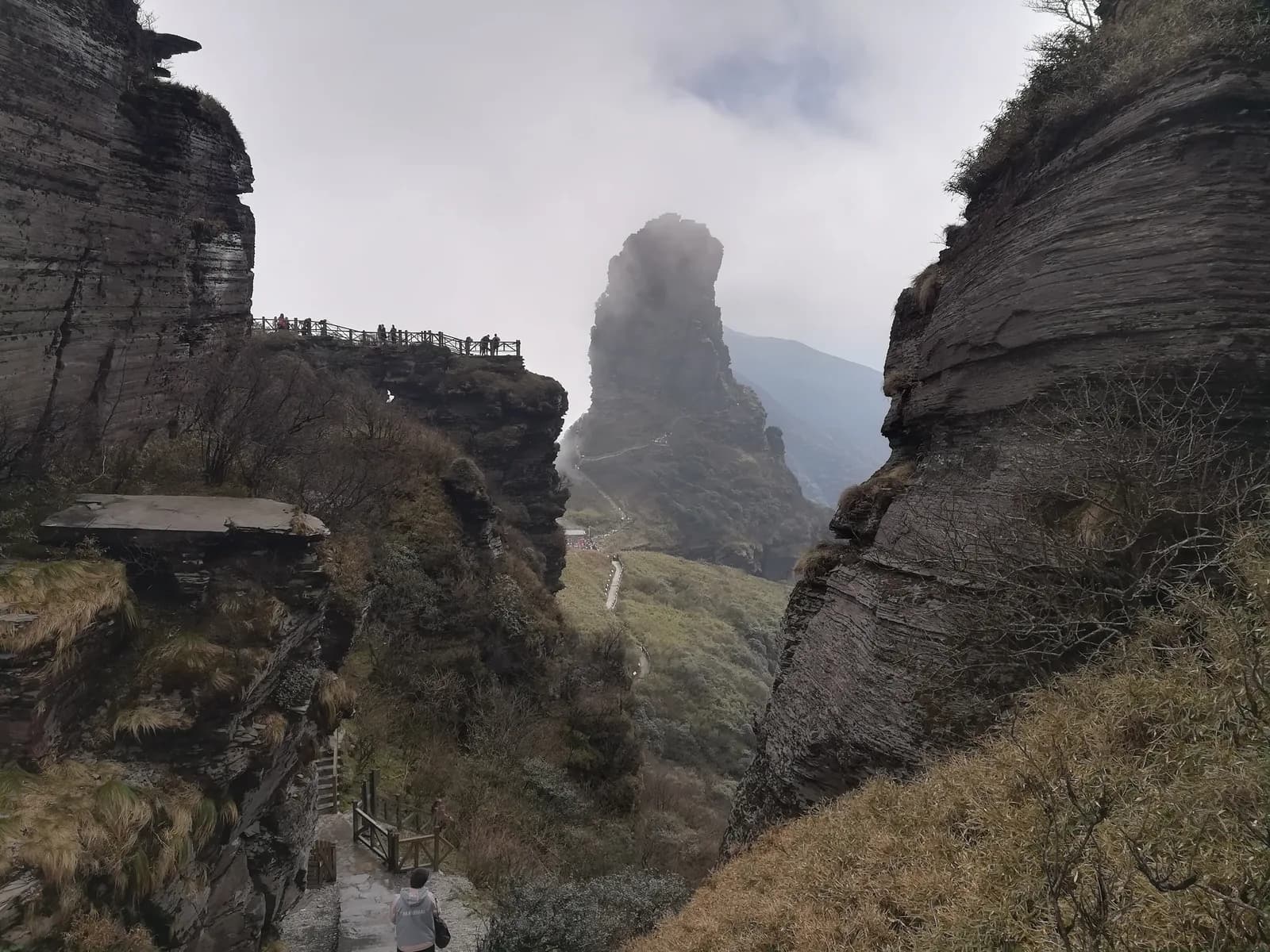 The Red Clouds Golden Summit rock pinnacle at Mount Fanjing with cliffside stairways and temple structures on top