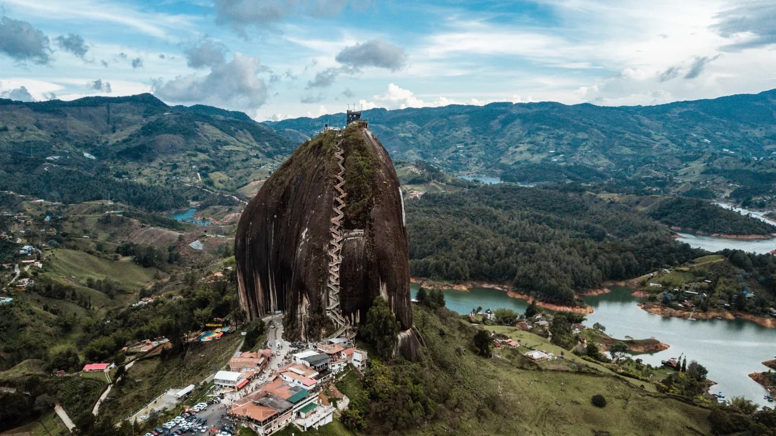 Aerial view of the Piedra del Peñol granite monolith rising above the island-dotted Guatapé reservoir