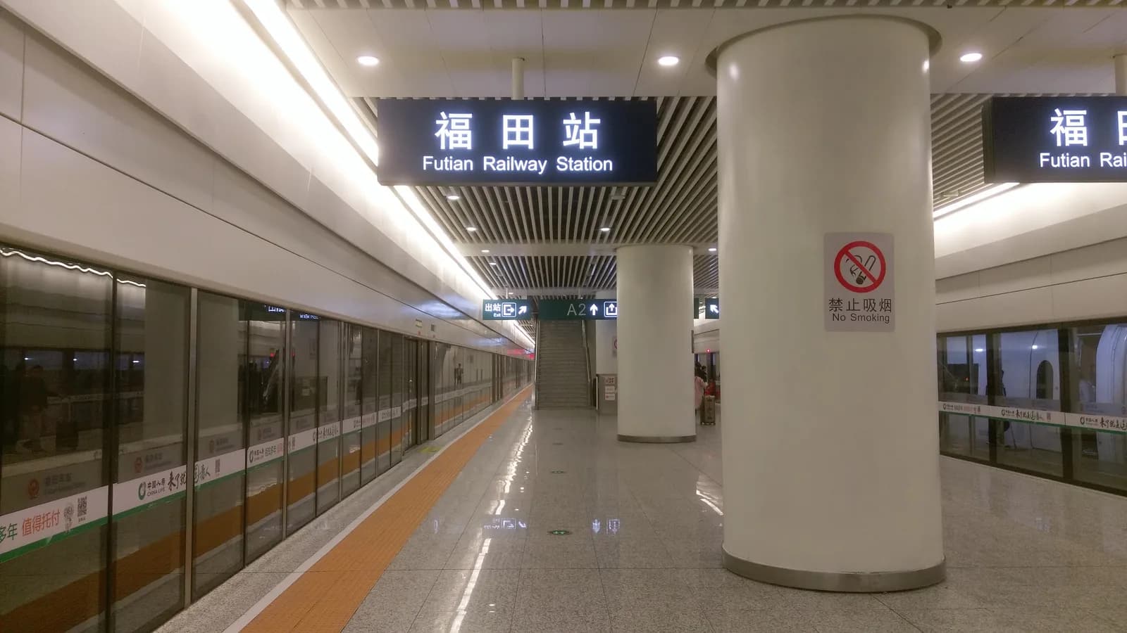 Platform level of Futian high-speed railway station in Shenzhen with a train waiting