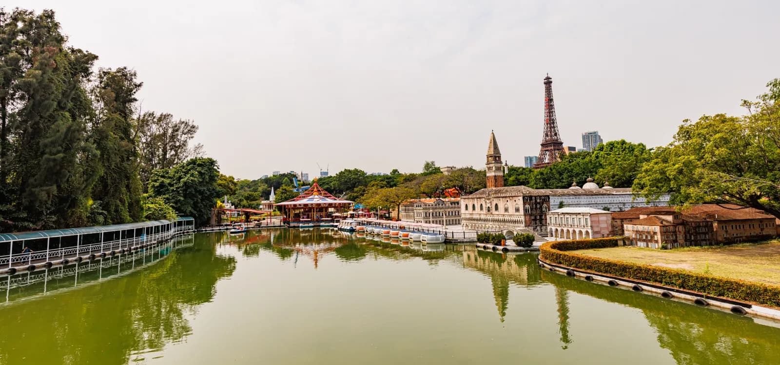 The lagoon at Window of the World in Shenzhen with a miniature Venice waterfront and the replica Eiffel Tower behind