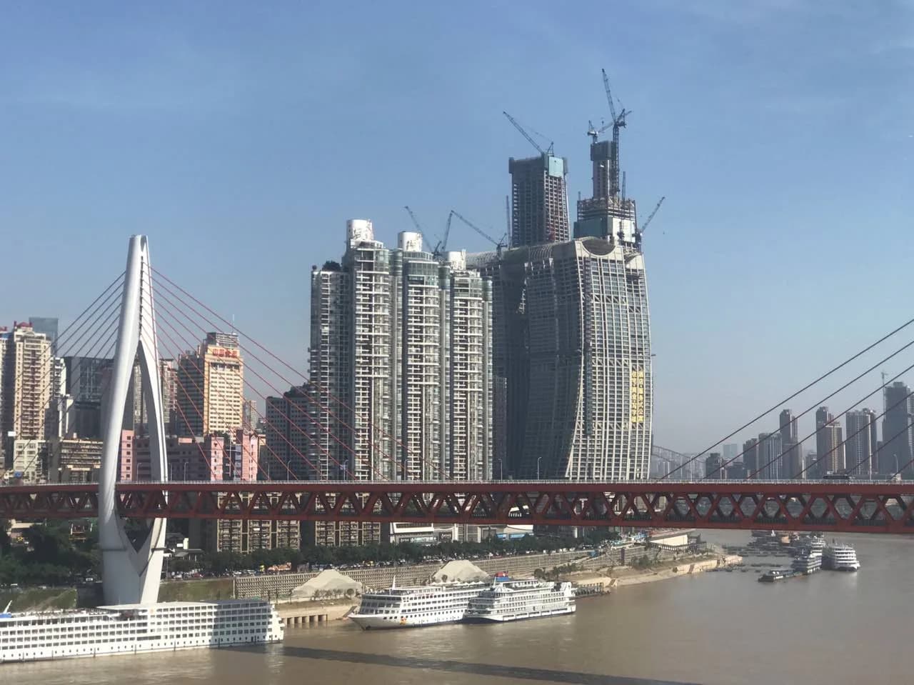 The Raffles City Chongqing towers at Chaotianmen with the connecting skybridge