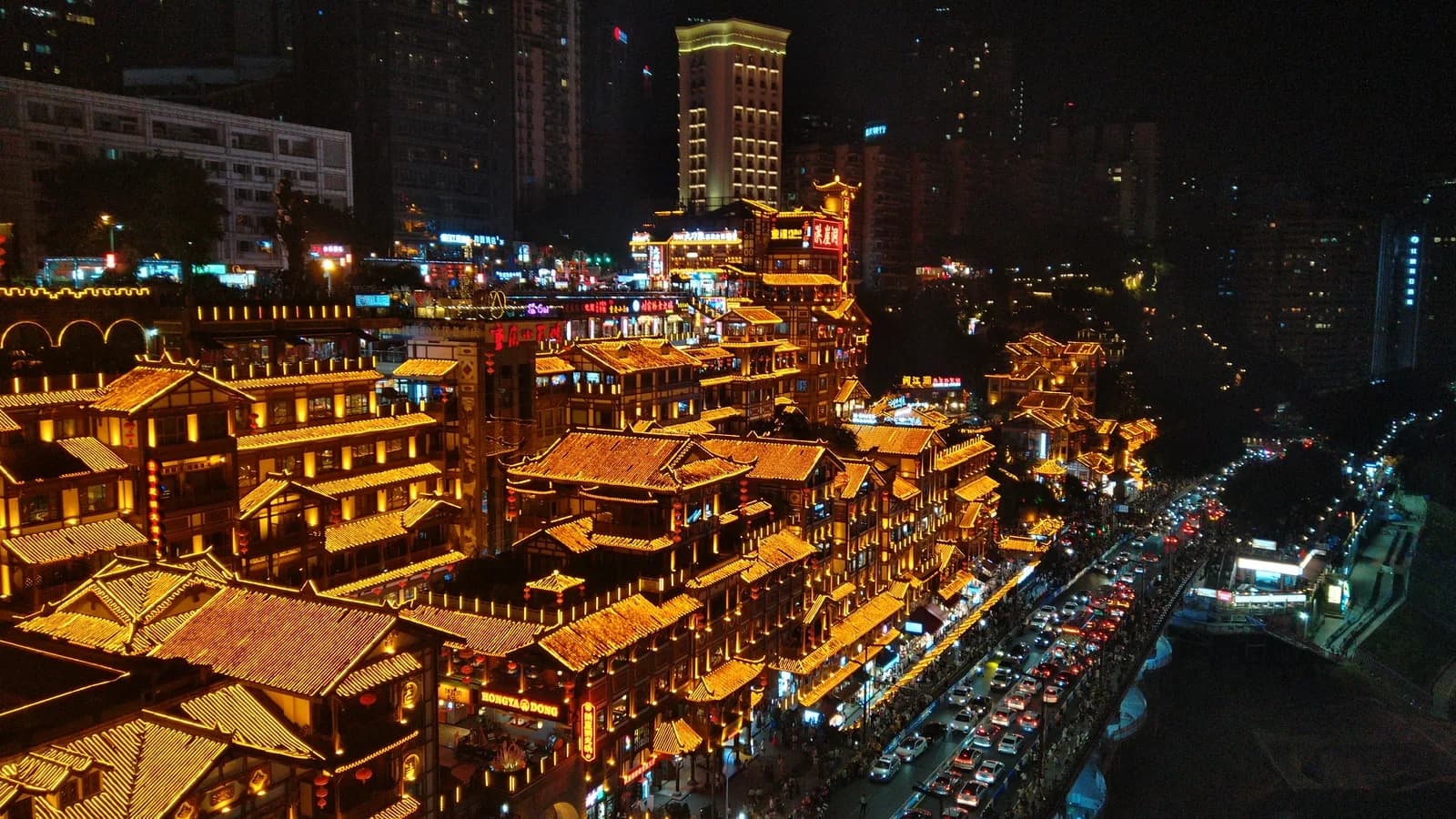 Hongya Cave illuminated at night on the Chongqing riverside, seen from Qiansimen Bridge