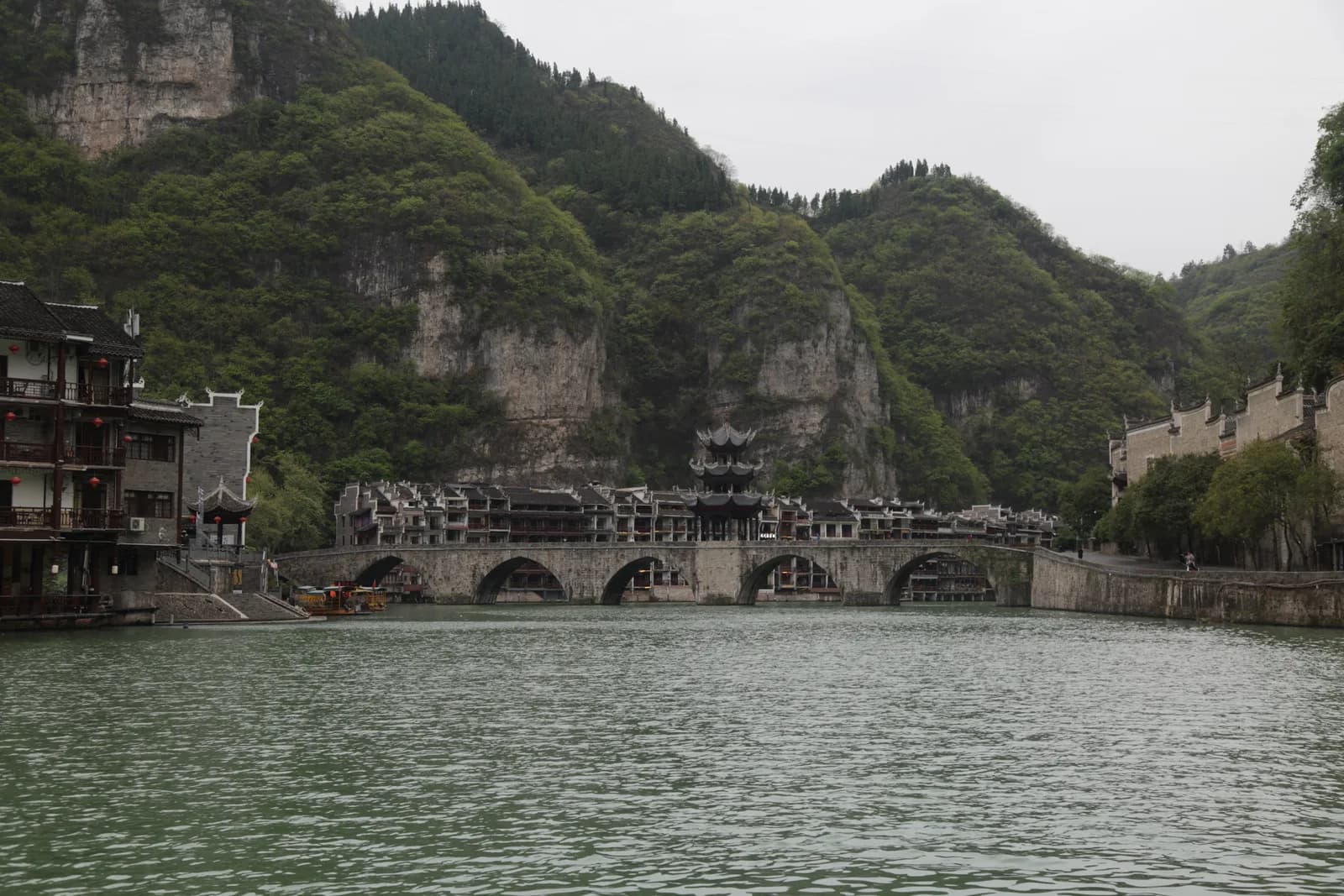 Zhusheng Bridge, a Ming dynasty stone arch bridge with a pavilion, spanning the Wuyang River at Zhenyuan